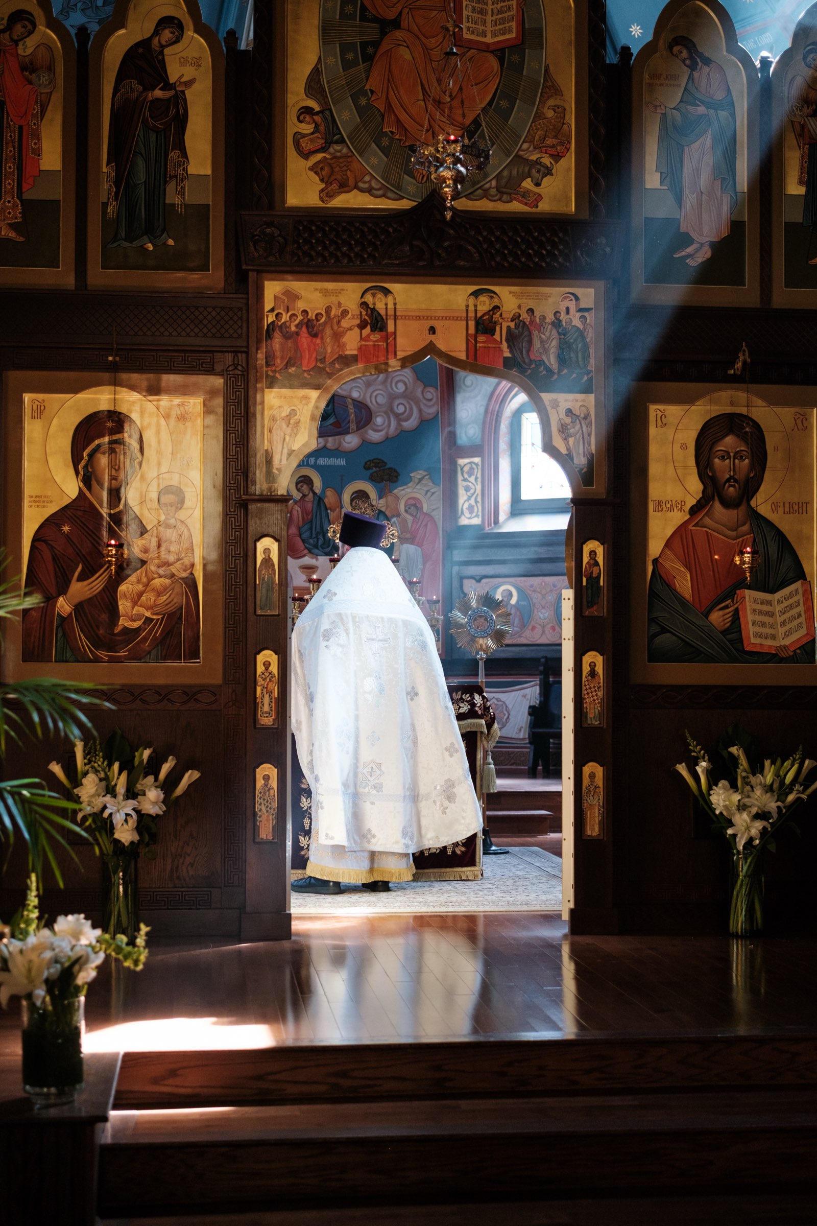 Light falling across the nave toward the open Royal Doors